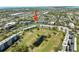 Beautiful aerial view of a condo community with golf course, pool, and lush landscaping at 4210 Ironwood Cir # 501J, Bradenton, FL 34209