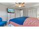 Comfortable bedroom with ceiling fan, large bed, ample closet space, and stylish decor at 4210 Ironwood Cir # 501J, Bradenton, FL 34209