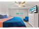 Cozy bedroom with ceiling fan, comfortable bed, and a view from the window at 4210 Ironwood Cir # 501J, Bradenton, FL 34209