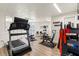 Bright gym area with wood-look floors, mirrors, and updated equipment for exercising at 4210 Ironwood Cir # 501J, Bradenton, FL 34209