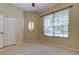 Bright bedroom featuring carpet, a ceiling fan, closet and natural light from the windows at 4702 Corsage Dr, Lutz, FL 33558