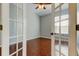 Bedroom features laminate flooring, gray walls, and a window at 4702 Corsage Dr, Lutz, FL 33558