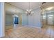 Dining room with large mirror feature wall and chandelier at 4702 Corsage Dr, Lutz, FL 33558
