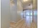 Hallway features tile floors and an arched entry to the living area at 4702 Corsage Dr, Lutz, FL 33558