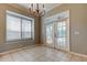 Bright dining room features large windows, shutters, and a chandelier at 4702 Corsage Dr, Lutz, FL 33558