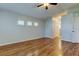 Bright main bedroom features hardwood floors and ample natural light at 4702 Corsage Dr, Lutz, FL 33558