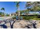 Relaxing pool area with comfortable seating, shade, and a well-maintained building nearby at 4702 Corsage Dr, Lutz, FL 33558