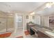 Bathroom with double sinks, granite countertops, and a walk-in shower at 4923 Eagle Rock Dr, Wimauma, FL 33598