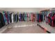 Walk-in closet with rods for hanging clothes and plenty of storage space at 4923 Eagle Rock Dr, Wimauma, FL 33598