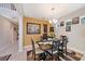 Inviting dining room with an elegant chandelier, wall decor, and a stylish table setting at 4923 Eagle Rock Dr, Wimauma, FL 33598