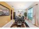 Inviting dining room with natural light, stylish decor, and a comfortable setting at 4923 Eagle Rock Dr, Wimauma, FL 33598