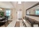 Bright, airy foyer with high ceilings, tile flooring, and a welcoming entrance at 4923 Eagle Rock Dr, Wimauma, FL 33598