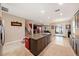 Spacious kitchen with a large island, granite countertops, and an open layout to the living area at 4923 Eagle Rock Dr, Wimauma, FL 33598