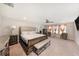 Large main bedroom with neutral tones, ceiling fan, and large windows with lots of light at 4923 Eagle Rock Dr, Wimauma, FL 33598