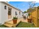 Backyard area with a small deck, privacy fence, and pea gravel at 4934 Dr Martin Luther King Jr N St, St Petersburg, FL 33703