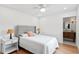 Serene bedroom with neutral tones, hardwood floors, and a glimpse of the ensuite bathroom at 4934 Dr Martin Luther King Jr N St, St Petersburg, FL 33703