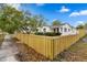 Charming single-story home with a well-maintained lawn and a newly constructed wooden fence at 4934 Dr Martin Luther King Jr N St, St Petersburg, FL 33703