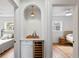 Hallway featuring a built-in wine fridge and shelving in between two bedrooms at 4934 Dr Martin Luther King Jr N St, St Petersburg, FL 33703