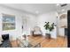 Bright living room with hardwood floors and a stylish decor creating an inviting space for relaxation at 4934 Dr Martin Luther King Jr N St, St Petersburg, FL 33703