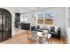 Stylish living room featuring hardwood floors, modern furniture, and large windows offering plenty of natural light at 4934 Dr Martin Luther King Jr N St, St Petersburg, FL 33703