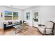 Cozy living room with a comfortable couch, hardwood floors, and a bright atmosphere with natural lighting at 4934 Dr Martin Luther King Jr N St, St Petersburg, FL 33703