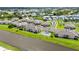 Aerial view of condo community with beautiful landscaping, water views, and community amenities at 5800 Sabal Trace Dr # 301, North Port, FL 34287
