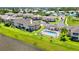 Aerial view of condo community featuring a refreshing community pool and manicured green spaces at 5800 Sabal Trace Dr # 301, North Port, FL 34287