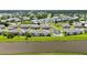 Gorgeous aerial view of condo community highlighting the community pool and serene lake setting at 5800 Sabal Trace Dr # 301, North Port, FL 34287