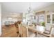 Open dining space with elegant table, hardwood floors, and lots of natural light at 5800 Sabal Trace Dr # 301, North Port, FL 34287