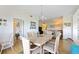Dining room with chandelier, table and seating area, and an open floor plan at 5800 Sabal Trace Dr # 301, North Port, FL 34287