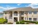 Charming condo exterior with balcony, neutral colors, and lush landscaping at 5800 Sabal Trace Dr # 301, North Port, FL 34287