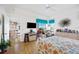 Bright and open bedroom with a seamless transition to a dining area, offering ample natural light and elegant decor at 5800 Sabal Trace Dr # 301, North Port, FL 34287