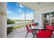 Enclosed patio with seating area and scenic views of the water and landscape at 5800 Sabal Trace Dr # 301, North Port, FL 34287