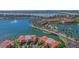 Aerial view of waterfront homes with red tile roofs and a waterway with lush landscaping at 6100 Bahia Del Mar Cir # 204, St Petersburg, FL 33715