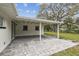 Concrete back patio in the back of the house with nice shade at 7310 Donna Dr, New Port Richey, FL 34652