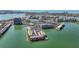 Aerial view of waterfront condo community featuring water views and boat docks at 7665 Sun Island S Dr # 401, South Pasadena, FL 33707