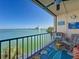 Inviting balcony with comfortable seating showcasing views of the water and city skyline at 7665 Sun Island S Dr # 401, South Pasadena, FL 33707