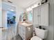 Bathroom with granite countertops, modern vanity and toilet at 7665 Sun Island S Dr # 401, South Pasadena, FL 33707