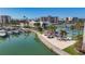 Community view featuring waterfront access, docks, tennis courts, and tiki hut lounging area at 7665 Sun Island S Dr # 401, South Pasadena, FL 33707