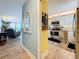 Interior view leading from the living room and kitchen with hard surface flooring at 7665 Sun Island S Dr # 401, South Pasadena, FL 33707