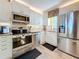 Kitchen with stainless steel appliances, and granite countertops at 7665 Sun Island S Dr # 401, South Pasadena, FL 33707