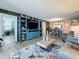 Spacious living room with dining area and entertainment center at 7665 Sun Island S Dr # 401, South Pasadena, FL 33707