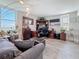 Comfortable living room with desk area, complemented by a modern floor lamp and large windows at 7665 Sun Island S Dr # 401, South Pasadena, FL 33707