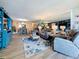 Open-concept living room and dining room with modern decor and plenty of natural light at 7665 Sun Island S Dr # 401, South Pasadena, FL 33707
