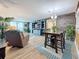 Open-concept living room and dining area with lots of natural light at 7665 Sun Island S Dr # 401, South Pasadena, FL 33707