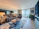 Bright living room with a large sliding glass door and water views at 7665 Sun Island S Dr # 401, South Pasadena, FL 33707