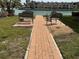 Serene outdoor seating area by the water, perfect for relaxation at 7665 Sun Island S Dr # 401, South Pasadena, FL 33707