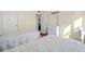 Bright bedroom with two twin beds, a work desk, and an open doorway at 7701 Starkey Rd # 526, Seminole, FL 33777