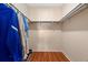 Walk-in closet with hanging rods, and some clothing shown in a corner at 7701 Starkey Rd # 526, Seminole, FL 33777