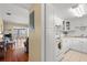 Well-lit kitchen with white cabinets and appliances, and an open view to the living room at 7701 Starkey Rd # 526, Seminole, FL 33777